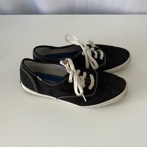 Black Keds sneakers with white shoelaces